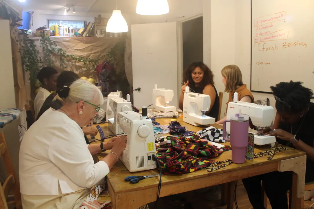 People sewing together in the studio