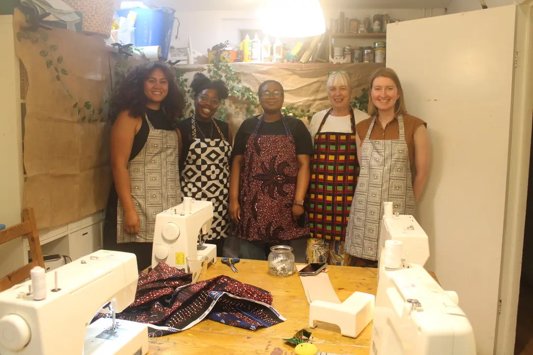 Community members sewing together