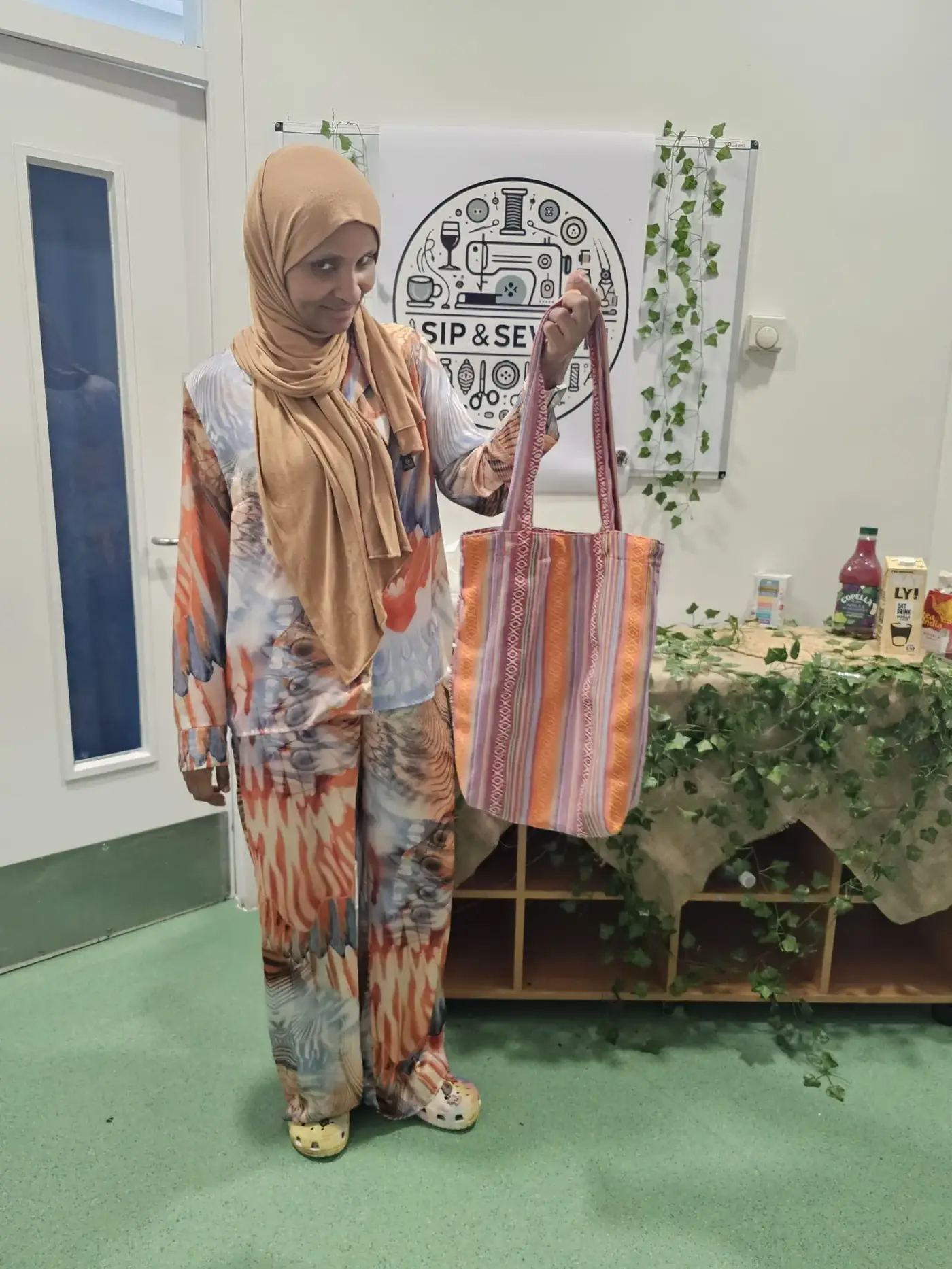 Participants sewing together in the studio